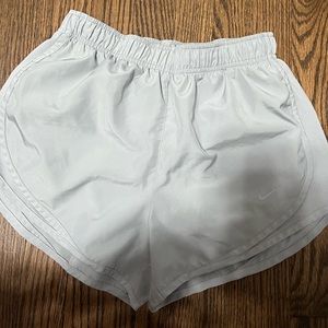 Iight grey women’s Nike athletic shorts, never worn, size small